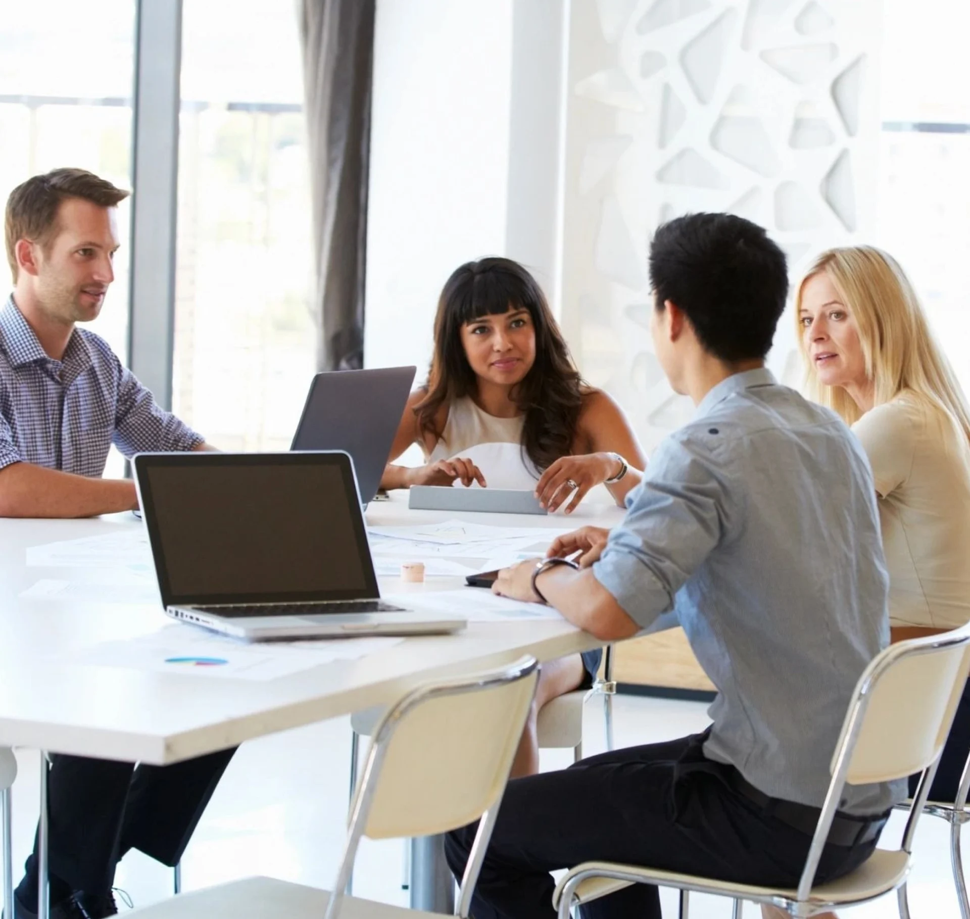 A group of people sitting around a table.